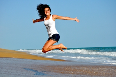 Girl jumping at beach